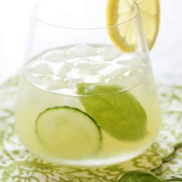 With the holiday weekend coming, if you're looking for a signature cocktail that looks like it jumped right off a spa cuisine menu for under 140 calories, this is it! Made with muddled cucumbers, basil, lemon juice, gin and a splash of seltzer, it's light and summery and perfect to serve at your next party.