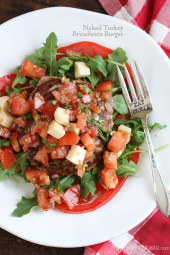 Naked Turkey Bruschetta Burger are healthy, delicious, turkey burgers made juicy thanks to added zucchini and topped with a summer garden tomato bruschetta topping over a bed of baby arugula – no bun required!