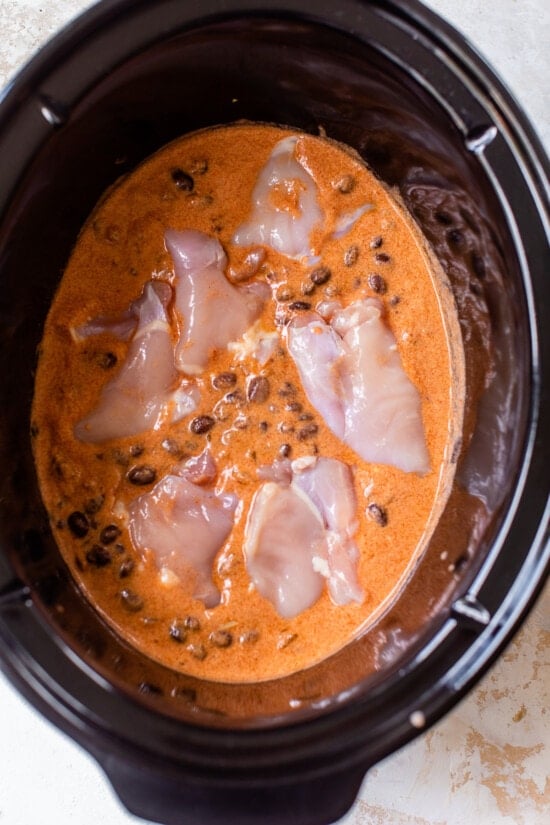 chicken, enchilada sauce, beans in slow cooker