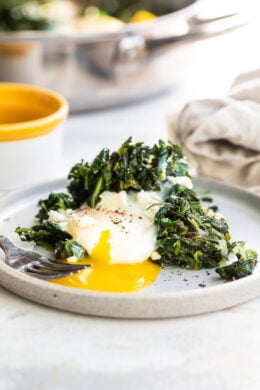 egg with runny yolk and spinach.