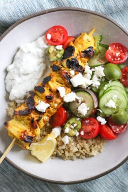 Smoky yogurt-marinated grilled chicken served over quinoa and Mediterranean-inspired tomatoes, cucumbers, and olives with tzatziki and Feta.