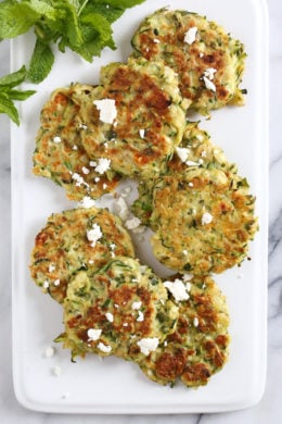 Zucchini and Feta Fritters, a fabulous summer side dish to make great use of in-season zucchini and mint.